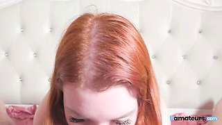 POV dick-sucking session in the bedroom with a hot redhead babe
