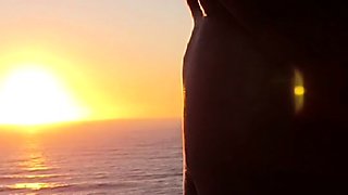 Buxom babe shows off sexy body in nude poses at sunset