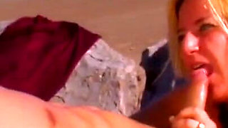 Busty MILF fucked at the beach