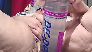 Big Bottle Plugged Clit Cunt