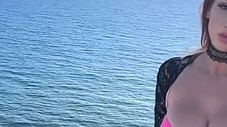 Artemisia Love Wearing Sexy Clothes and Smoking and Flashing Her Big Juicy Boobs in a Perfect Place by the Ocean
