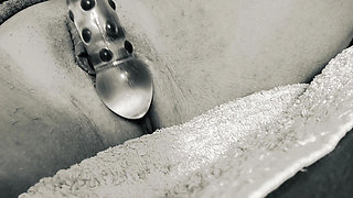 She lets the glass smack