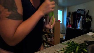 Hot French MILF Kahann masturbates with cucumber in kitchen close-up amateur video