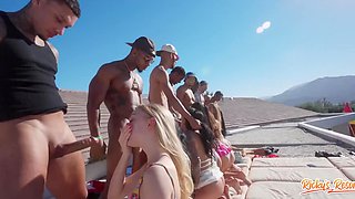 Golf course? Swimming pool? Inflatable castle? Doesn't matter - a big interracial orgy.
