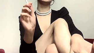 Brunette with foot fetish rubs big dick with her feet in POV