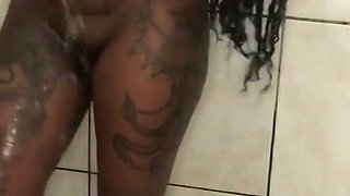 Ebony pearl pissing in shower