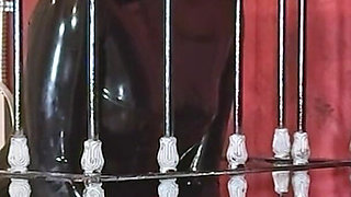 Imprisoned Rubber Slut Has to Give a Blowjob