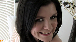 Brunette Girl Pleases Her Shaved Pussy with a Adult Toy on the Chair
