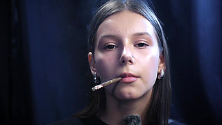 Young Girl Smoking Solo in a Calm Studio Session with Slow Exhales