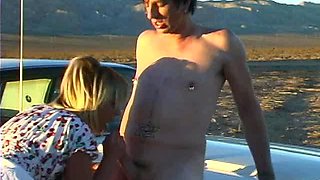 Blonde is flashing her big boobs in the outdoors