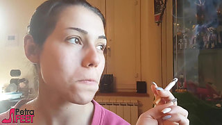 Tempting Italian girl smokes a cigar in a close up video