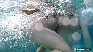 Three sets of huge, natural boobs underwater