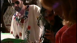 Ron Jeremy organizes orgy with a 70s crossdresser face fucking busty brunette on bed