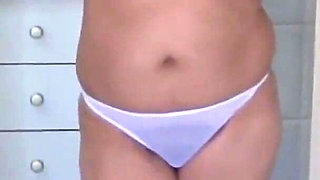 Stepmother Undresses to Put on Lingerie and Masturbates in Front of Stepson