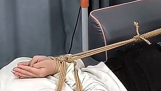 The Extreme Restraints of a Barefoot Girl, Playing with Her Bare Feet