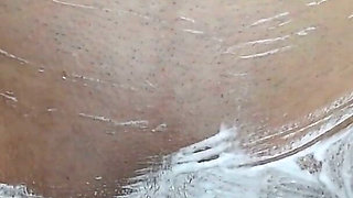 Close-up of Shaving the Vagina with a Trimmer and a Razor