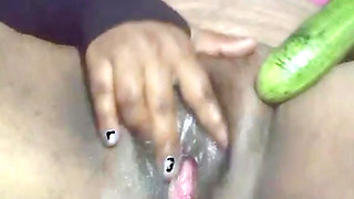 Today, Indian bhabhi quenched her desire by inserting a cucumber into her pussy.