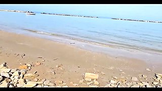 Violated by a massive phallus at an Italian nude shore. Sequence two.