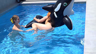 Lesbian Girls Are Having Fun in a Pool with an Inflatable Shark