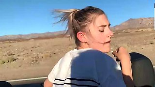Blonde young adult with enormous tits in a car