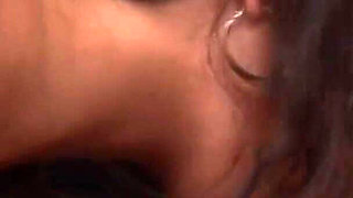 Two sexy brunette babes are having fun on the couch