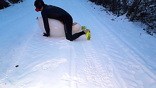 Playing with balloon in the snow